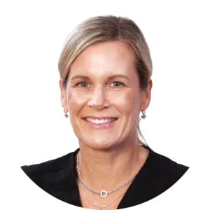 Smiling woman with blonde hair wearing a black top and silver necklace, head-and-shoulders portrait.