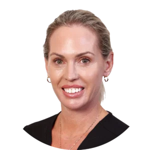 Smiling professional woman with blonde hair pulled back, wearing a black top and gold hoop earrings.